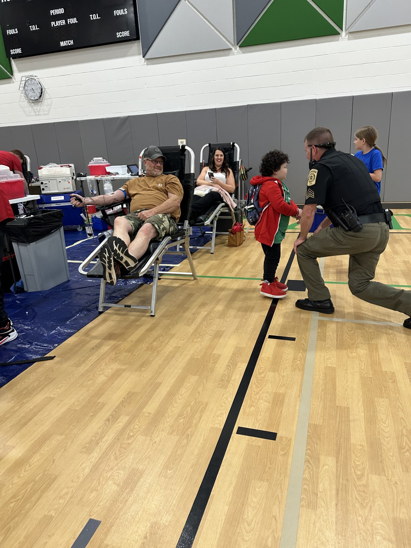Ollie with a police officer at his blood drive