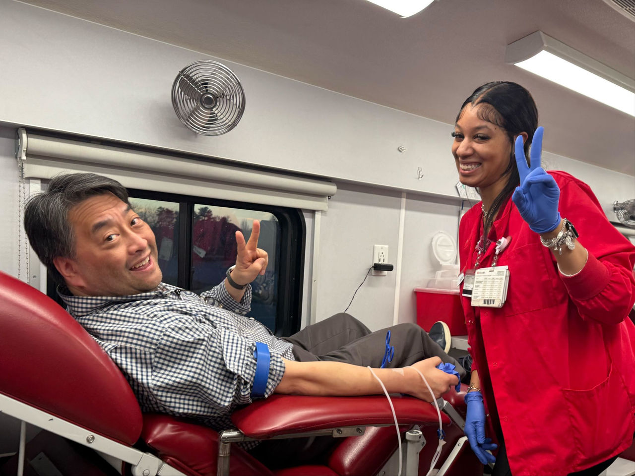 Dr. Oh donating on a mobile bus