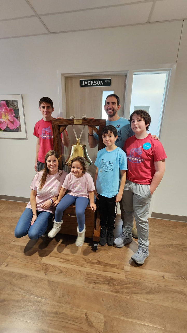 Everly and family with the bell