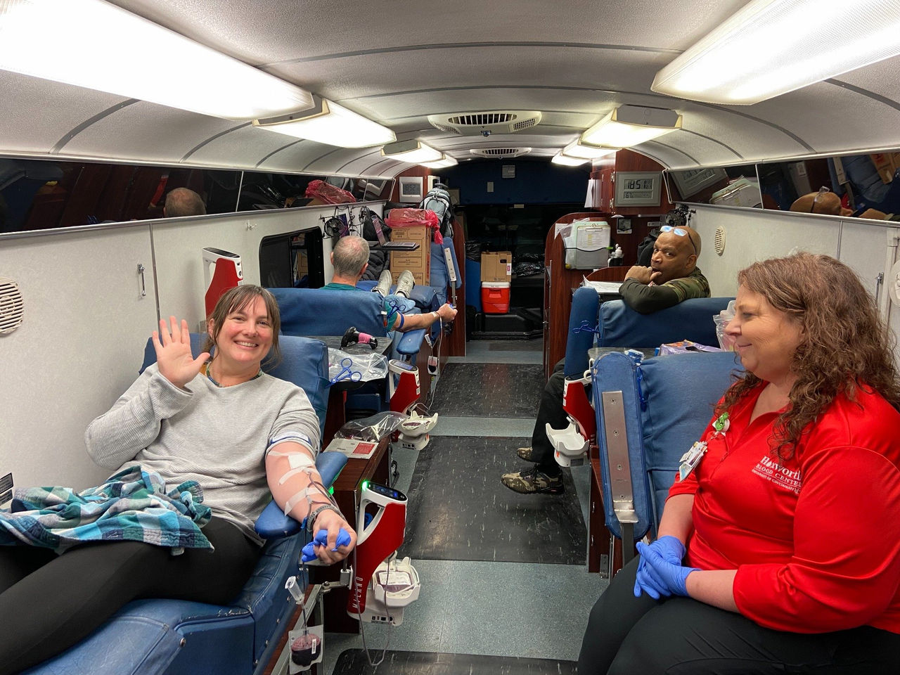 A donor giving blood on the bus