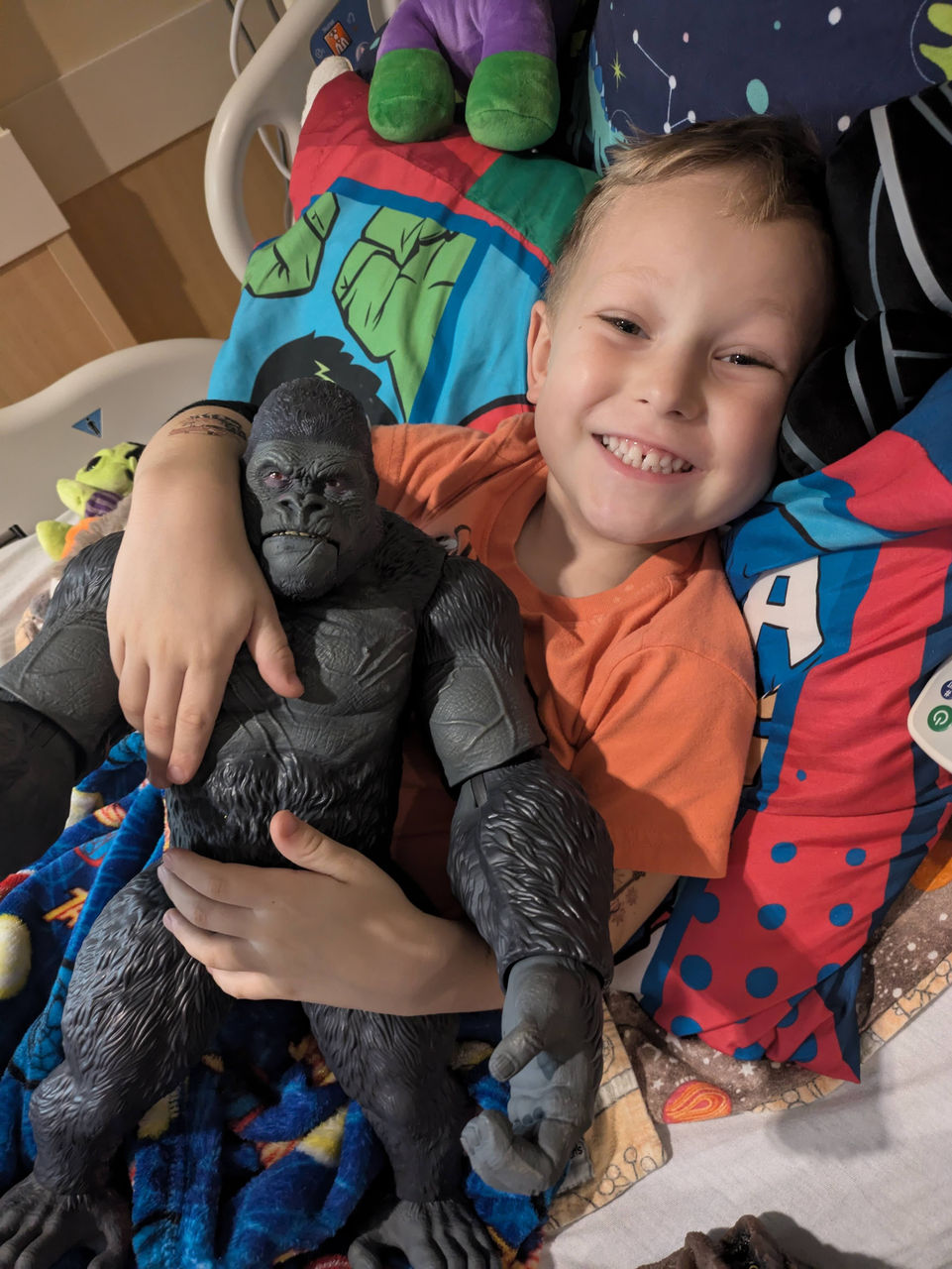 Cameron with super hero in bed