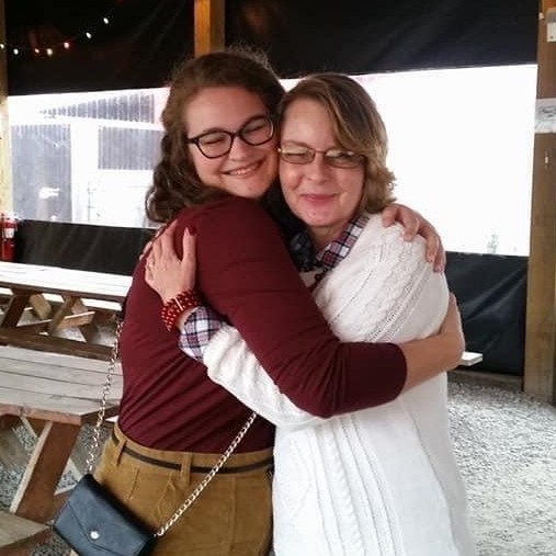 Melinda and Olivia embrace