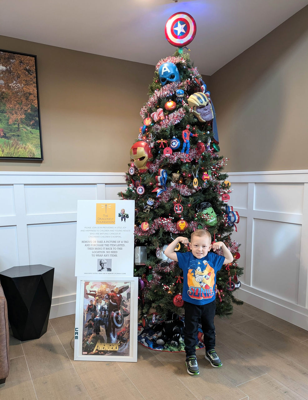 Cameron in front of the Christmas tree