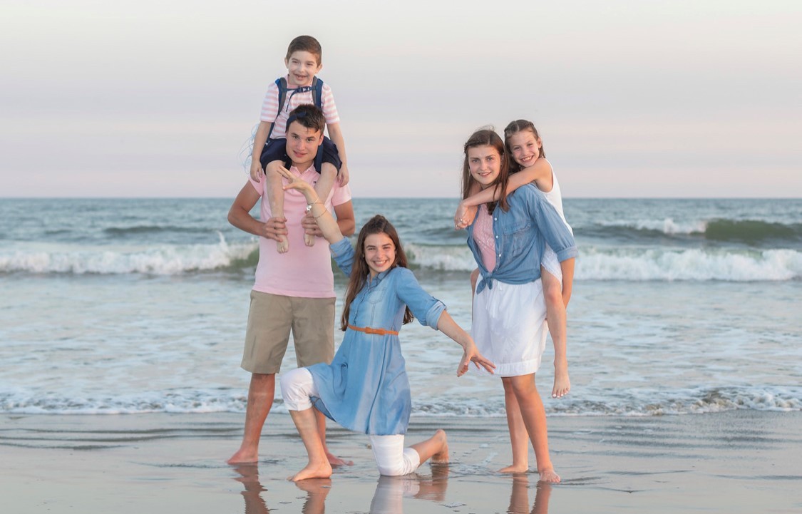Cohen and his four siblings at the beach
