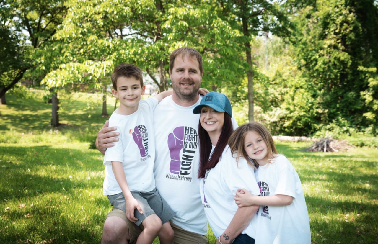 Mary Toennis  with her husband and two kids