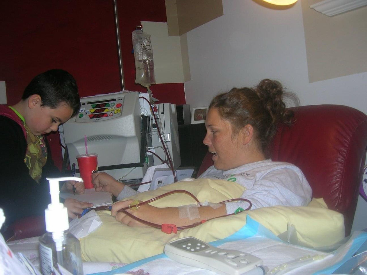 Perry in the hospital doing homework with her son